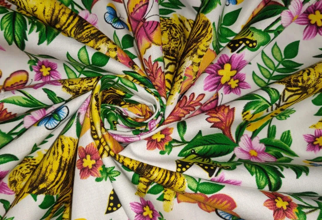 100% Cotton Poplin Print 58" wide available in two prints [ white floral jungle and black florall] [12804/05]